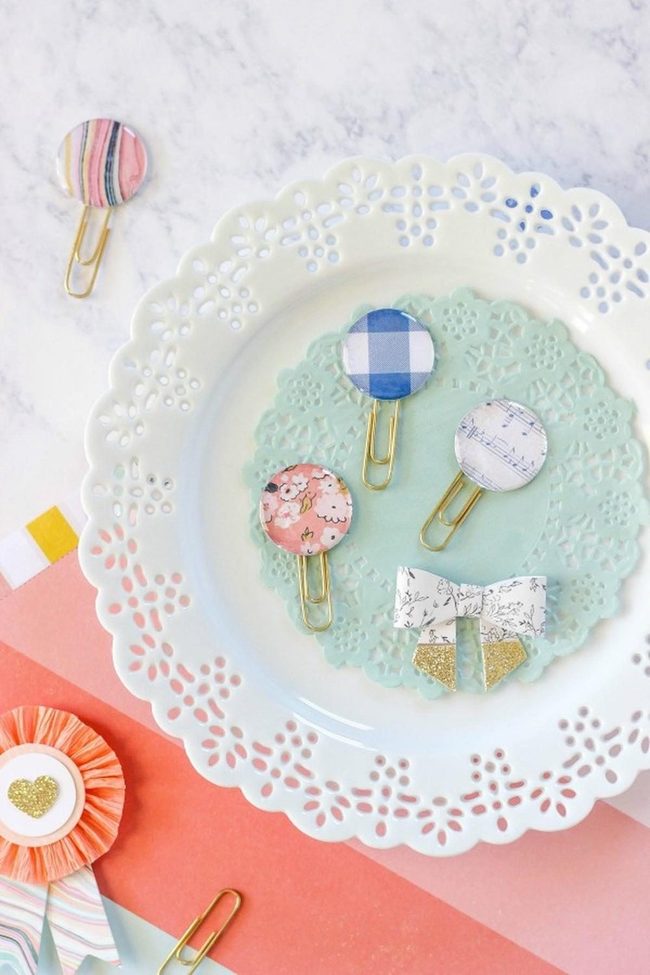 Colorful Paper Clips On Mint Doily