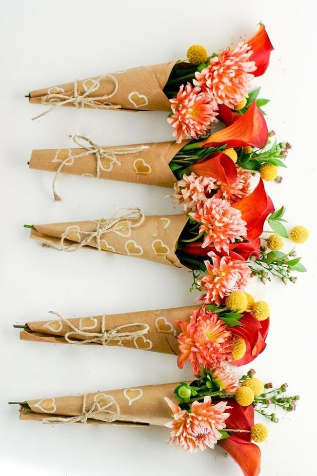 Orange Calla Lilies In Brown Paper