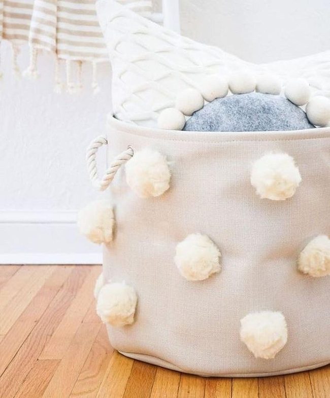 Woven Basket With Gray And White Pillows