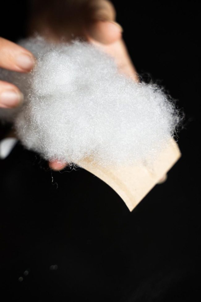 White Fiber Clouds On Dark Wood
