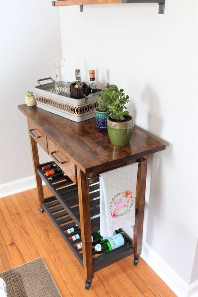Dark Wood Wine Cart With Green Plants