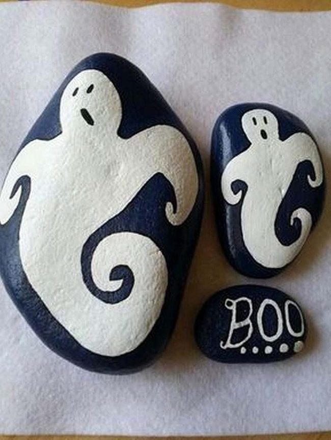 White Ghost Faces Black Pebbles