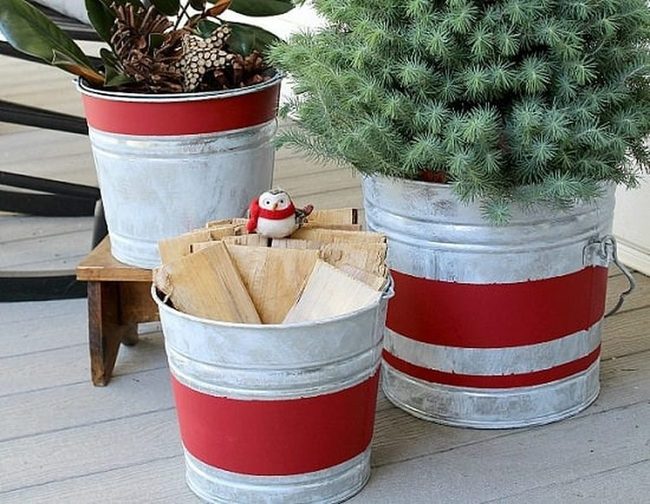 Rusted Metal Buckets With Cascading Evergreens
