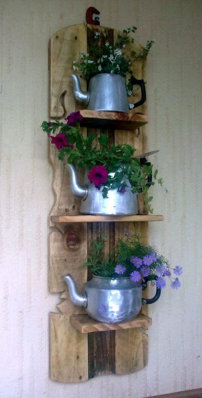 Cascading Flowers Through Vintage Teapots