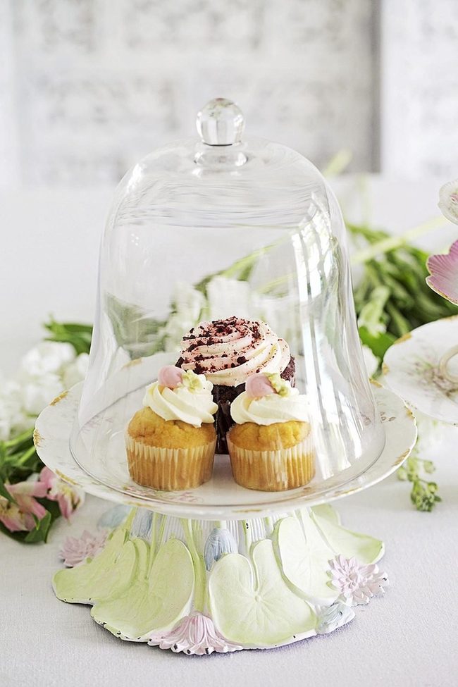 Pink Frosted Cupcakes Under Glass