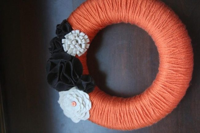 Orange Yarn Wreath With Fabric Flowers