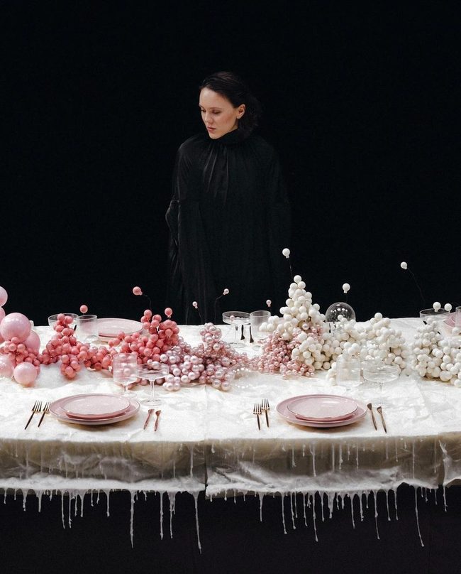 Soft Pink Tablescape Against Dark