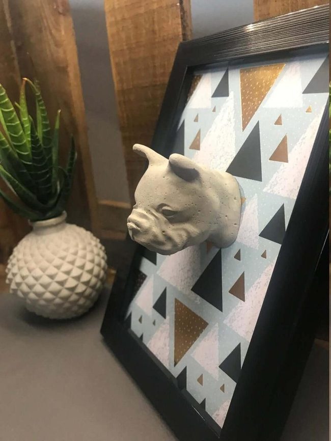 Concrete Bulldog Against Blue Geometry