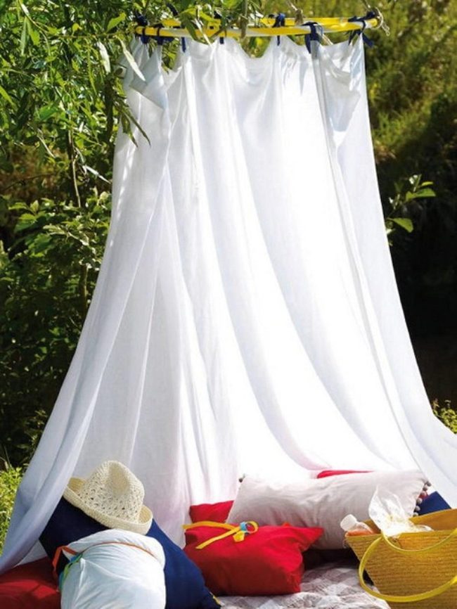 White Circular Curtain With Colorful Cushions