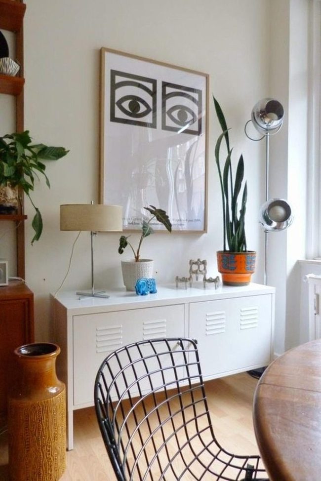 Black Eyes Art Above White Cabinet
