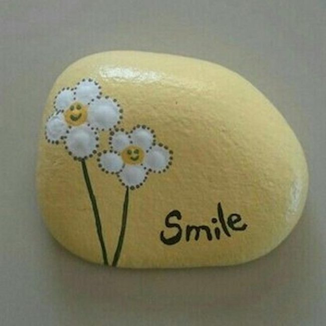 Yellow Stone Smiles With Flowers