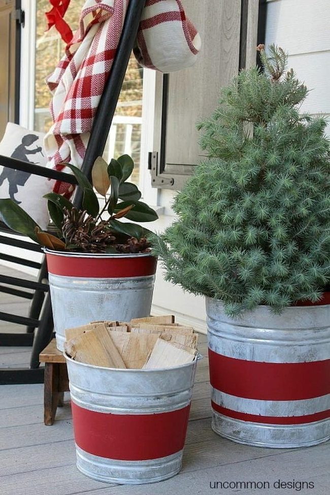 Stacked Metal Buckets With Seasonal Greenery