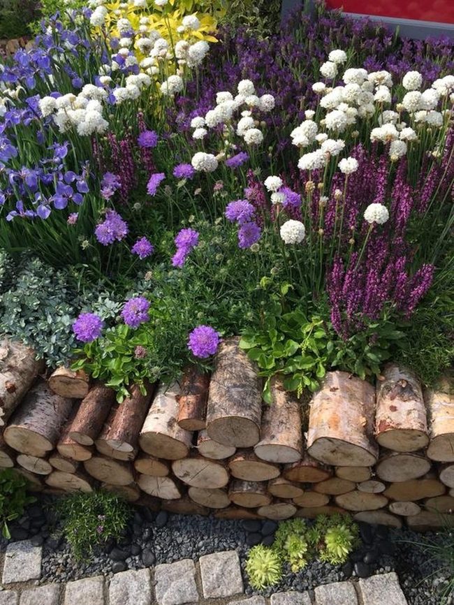 Purple Wildflower Garden With Stone Borders
