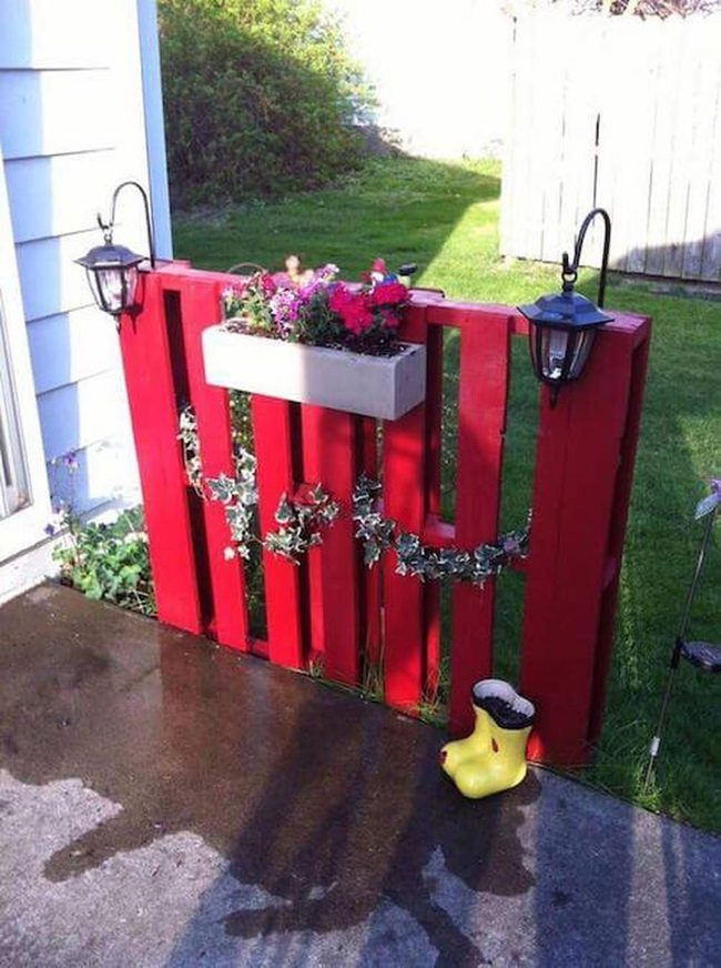 Red Wooden Gate With Flower Boxes