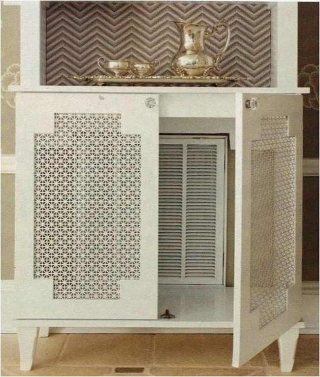 White Cabinet With Ornate Cutout Doors