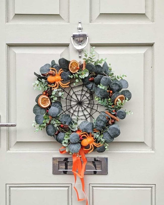 Black Wreath With Orange Slices And Spiders