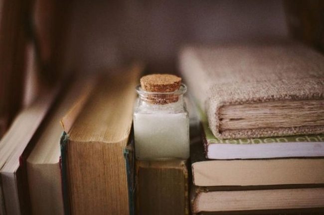 Worn Books And Glass Jar