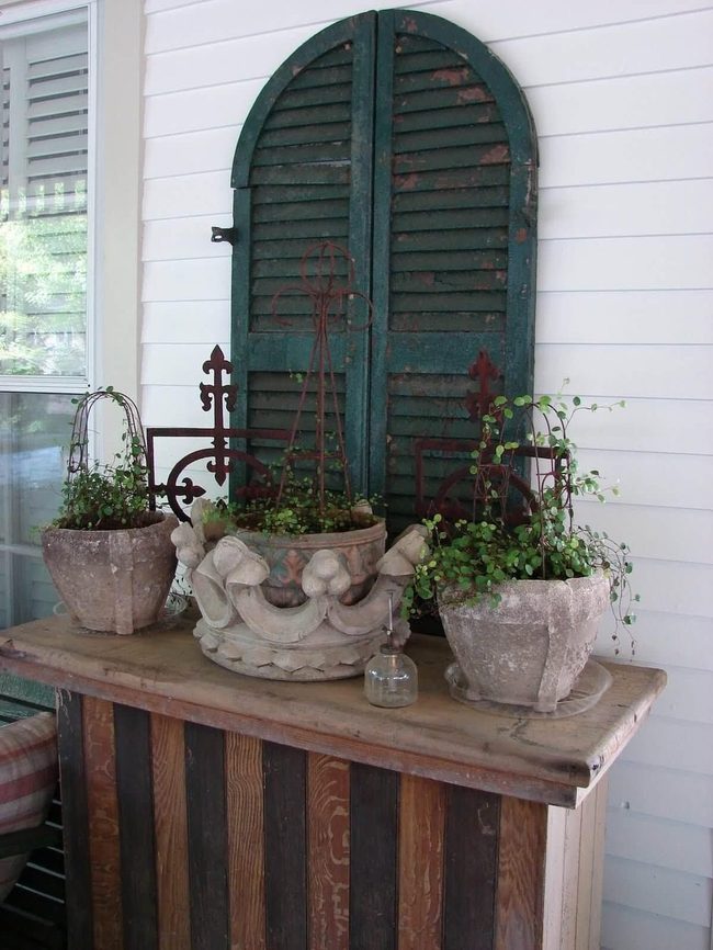 Colored Shutters Against Green