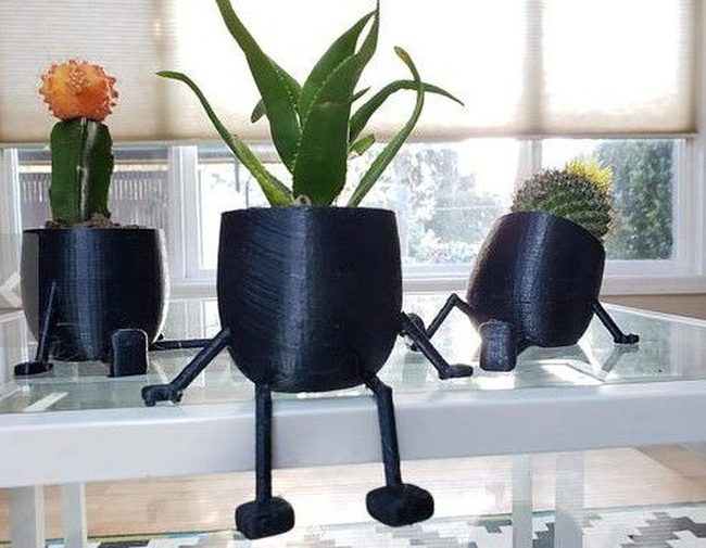 Lounging Figure Plant Sculptures