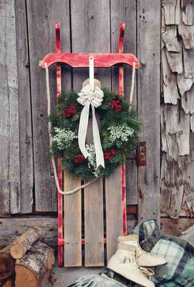 Wooden Sleds With Twinkling Greenery