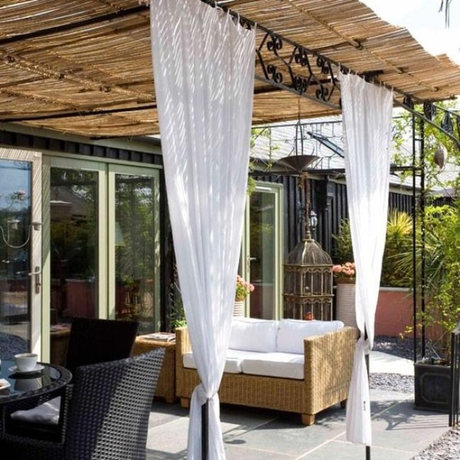 Wicker And Black Metal Garden Retreat