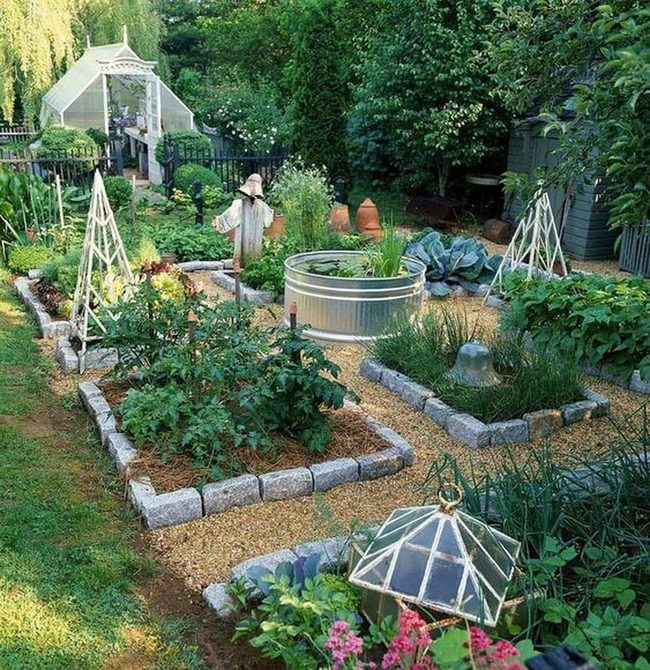 Stone-Lined Vegetable Garden With Evening Lights