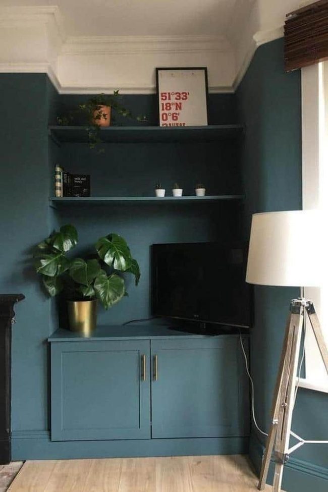 Teal Walls With Brass Hardware Statement