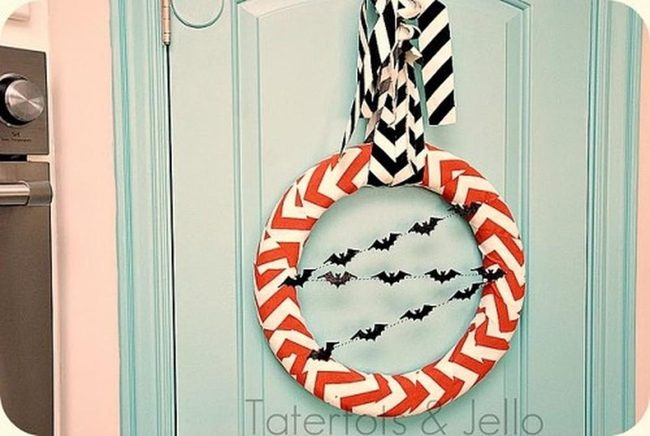 Blue Cabinets With Orange Bat Wreath