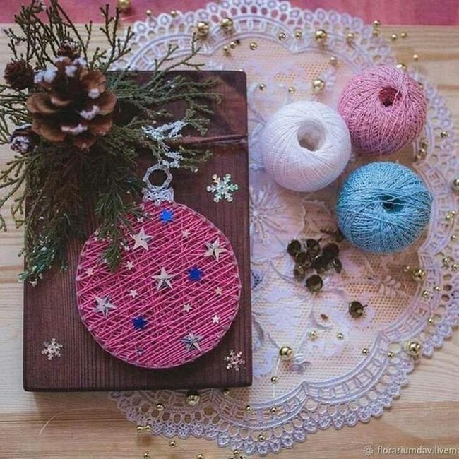 Pink String Ornament On Wood