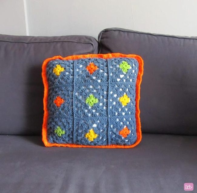 Orange-Bordered Crochet Pillows With Flowers