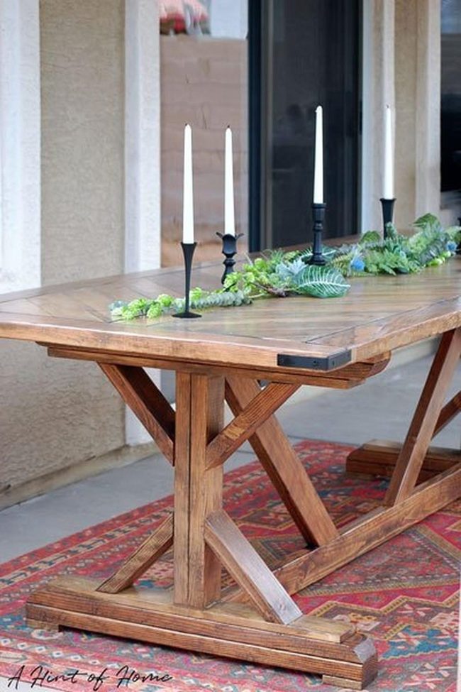Natural Wood Table With Red Rugs