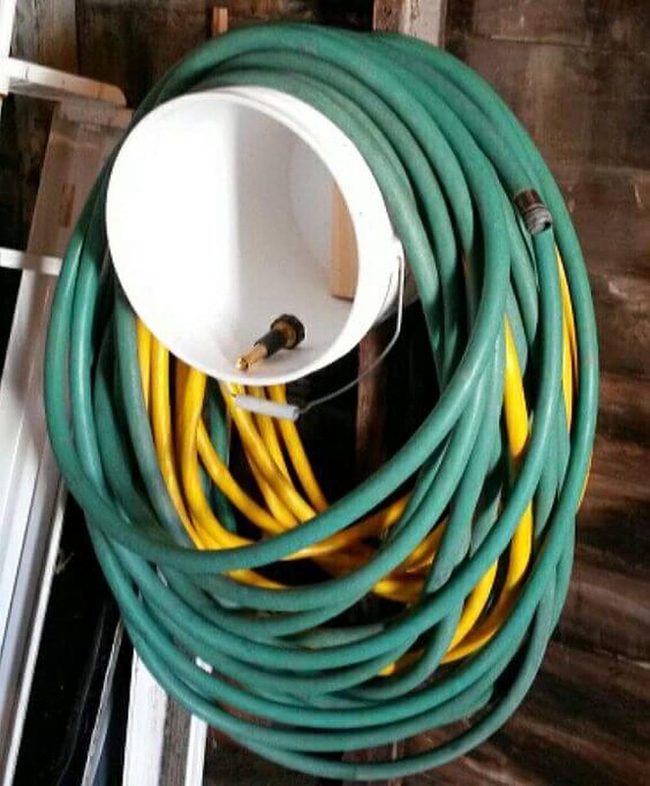 White Bucket Green Hose Storage