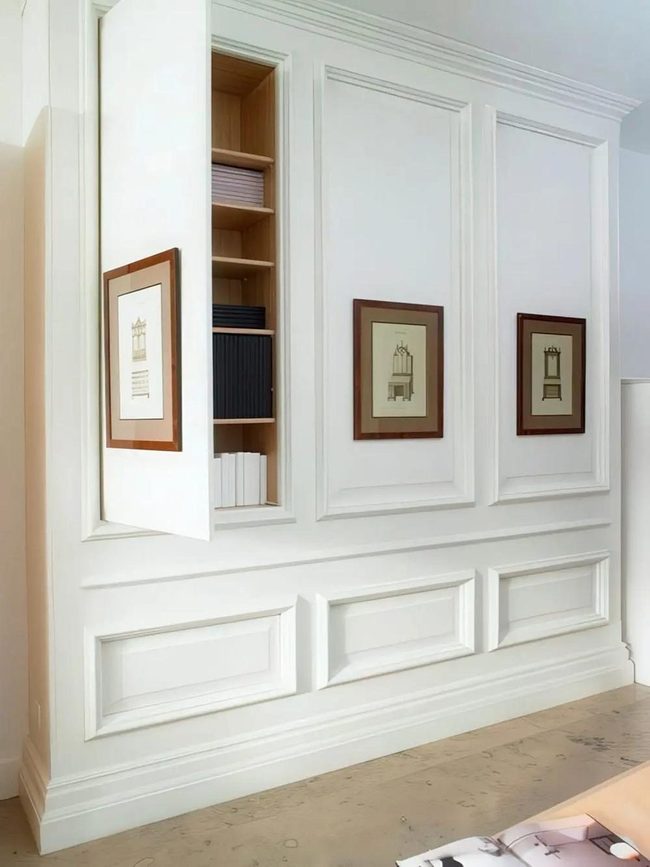 White Paneled Storage With Colorful Books