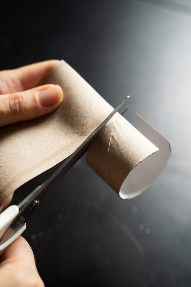 Scissors Slicing Brown Cardboard