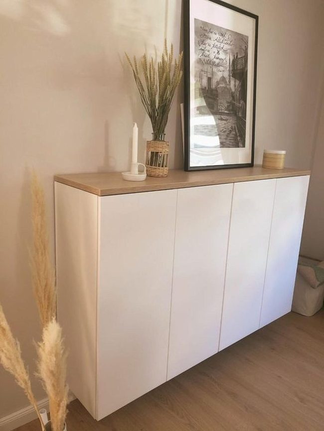 White Cabinet With Dried Grasses
