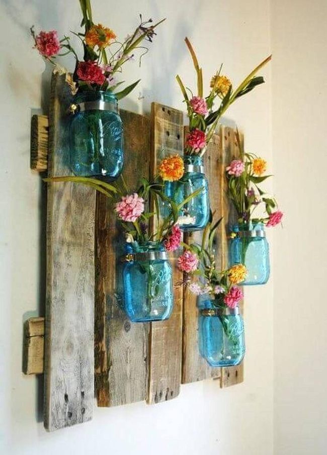 Blue Jar Flowers On Weathered Wood
