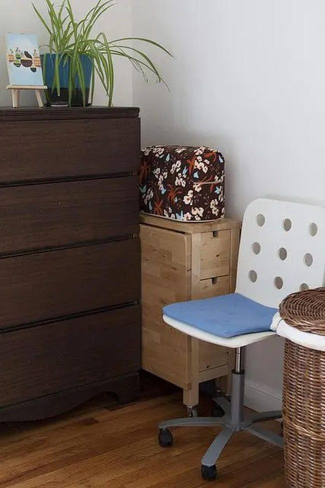 Dark Wood Dresser With Green Plants