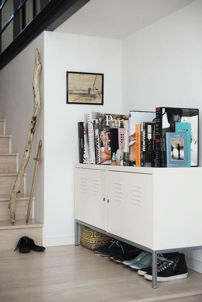 Colorful Books Against White Shelving