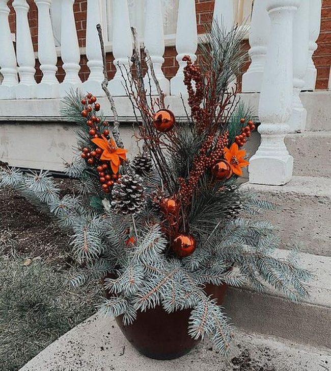 Weathered Pots With Pinecones And Greenery