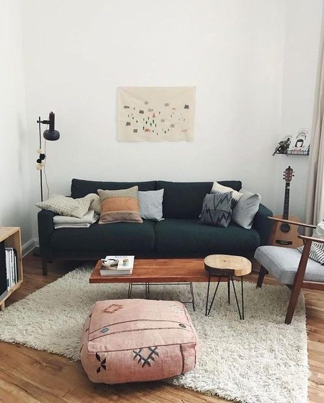 Green Sofa With Patterned Pillows