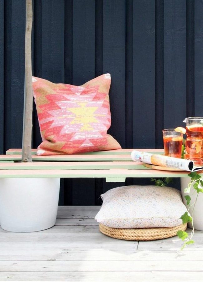 Navy Walls, Pink Pillows, Green Benches