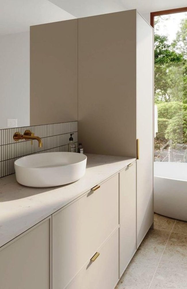 Beige Bathroom With Brass Accents
