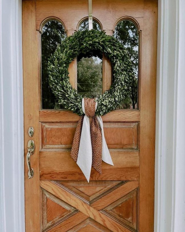 Green Foliage Wreath On Warm Wood