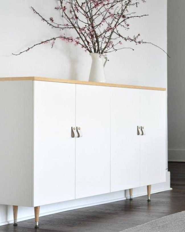 White Cabinet With Tapered Wooden Legs