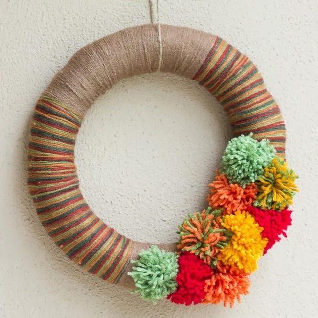Striped Yarn Wreath With Pom-Poms