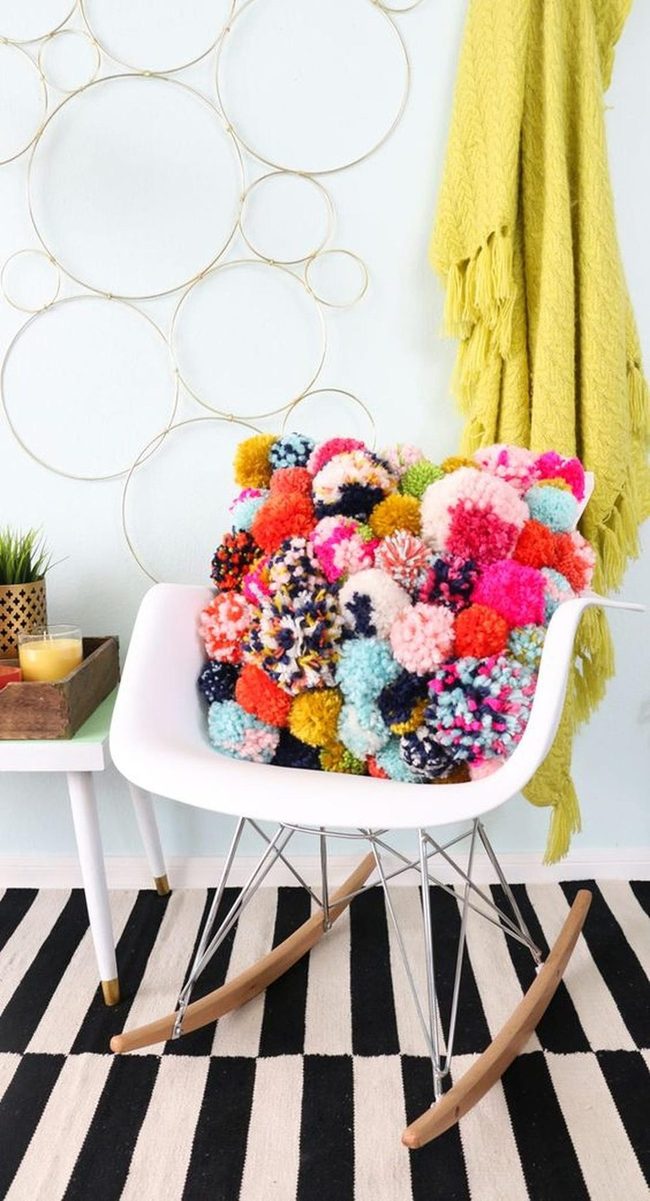 Colorful Pom-Poms On White Chair