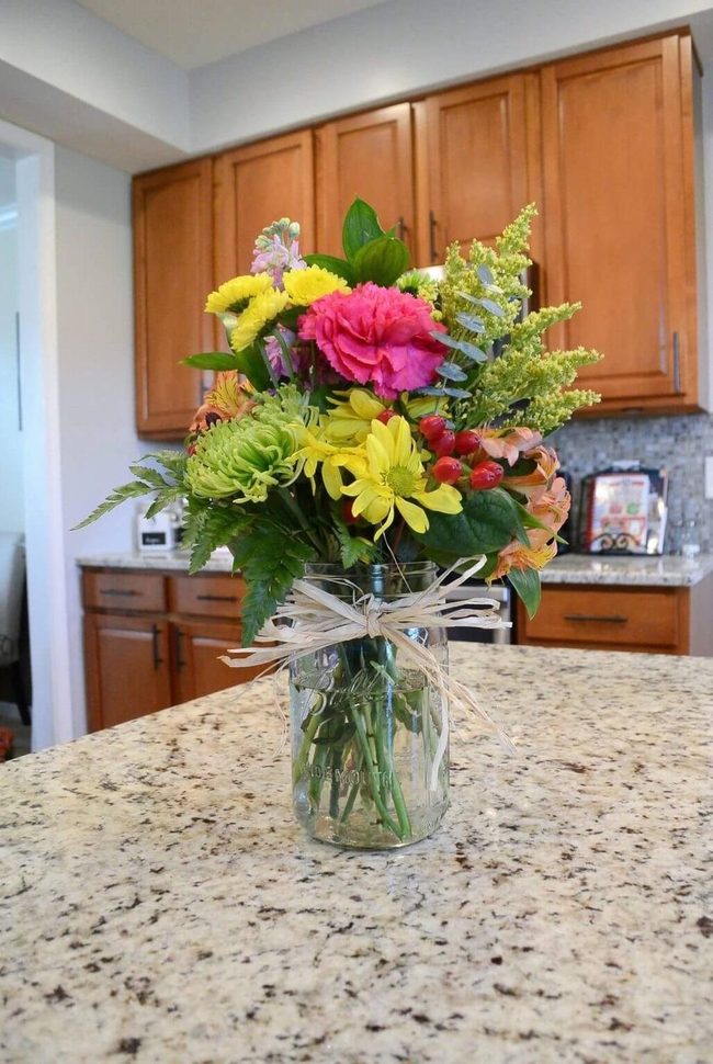 Fresh Blooms In Clear Glass