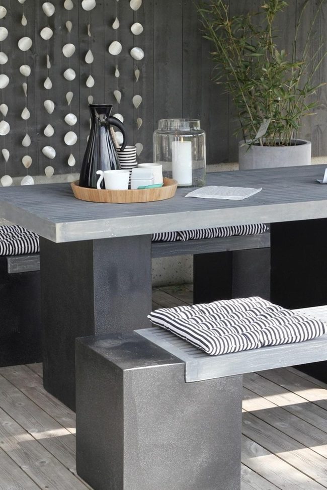Striped Cushions On Concrete And Wood