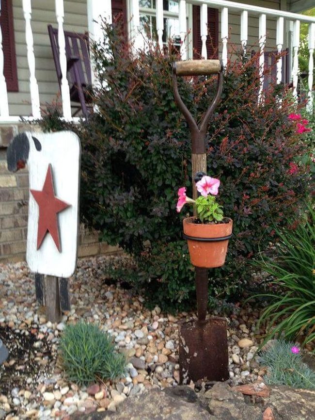 Shovel Among Blooming Flowers