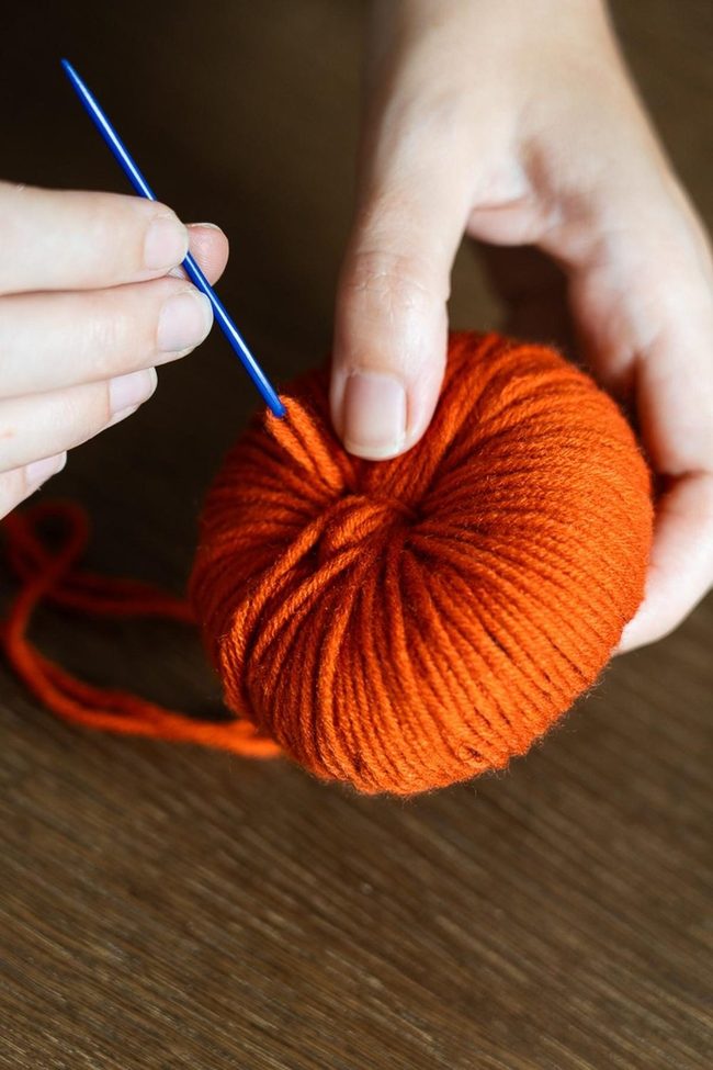 Orange Wool And Gleaming Needle